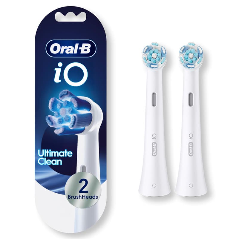 Bílé hlavice Oral-B iO Ultimate Clean s kulatou čisticí částí, oválným otvorem v krčku a označením iO